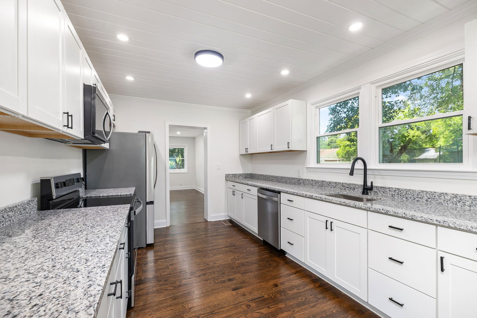 Updated white kitchen with granite counters